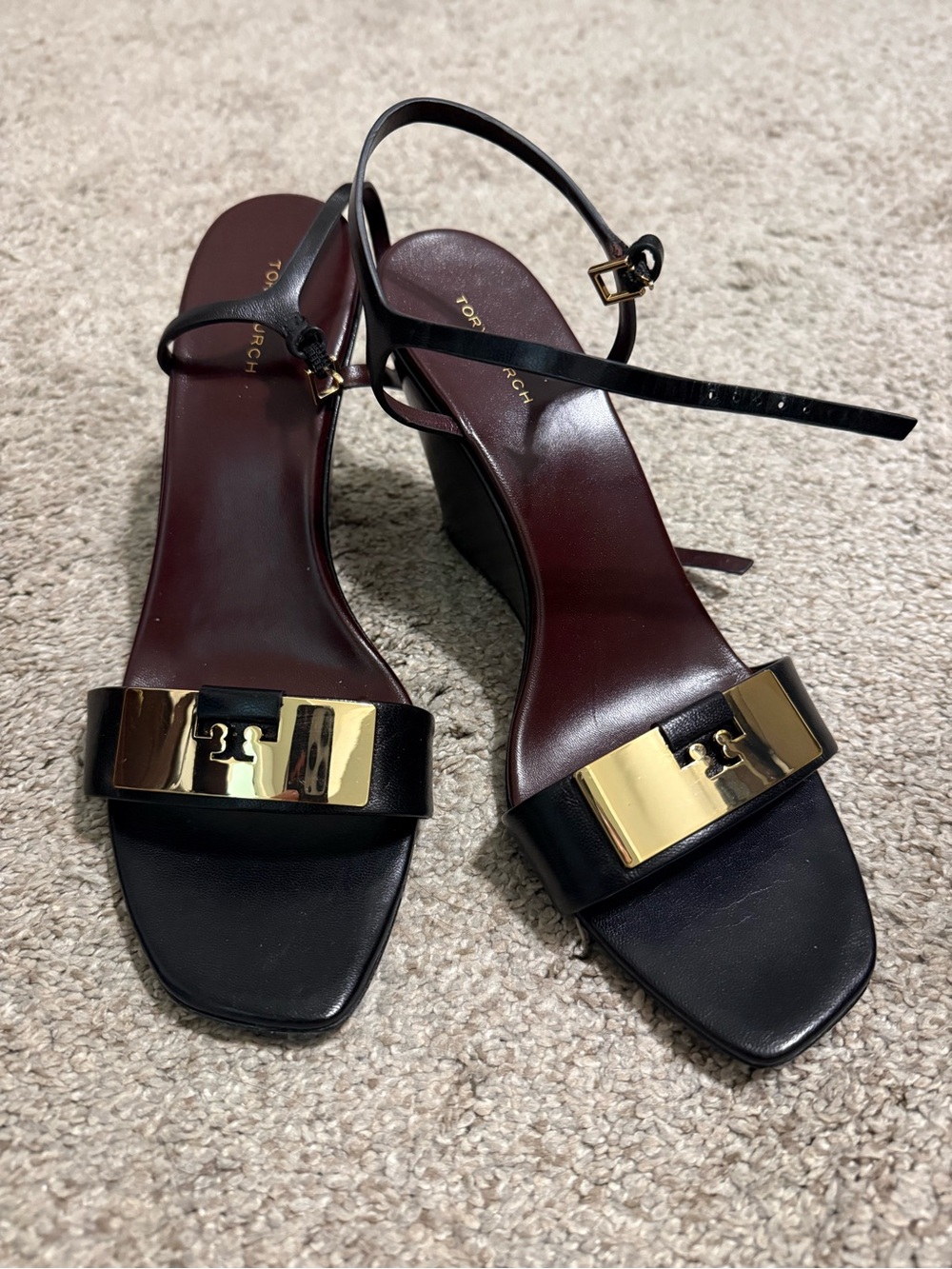 Tory Burch Black Leather Ankle-Strap Wedge Sandal with Gold Plaque